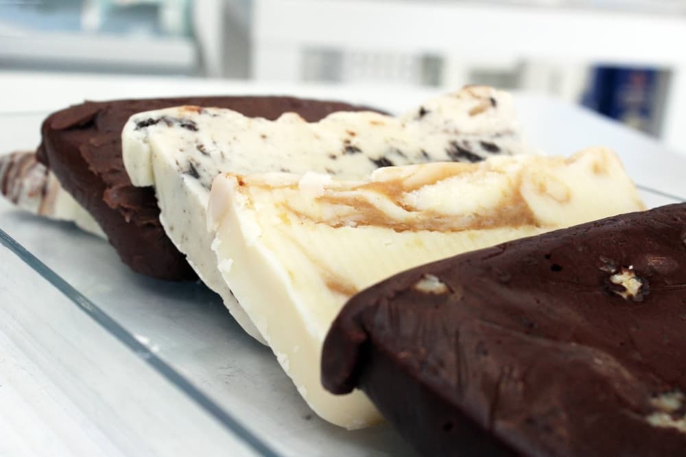 Four slices of different flavors of fudge. 