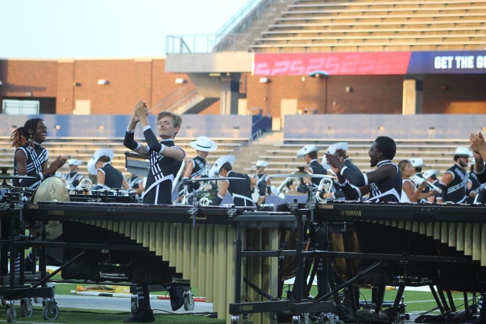 Members of the Crossmen Drum and Bugle Corps play percussion instruments during the DCI McKinney event held July 21 at McKinney ISD Stadium.
