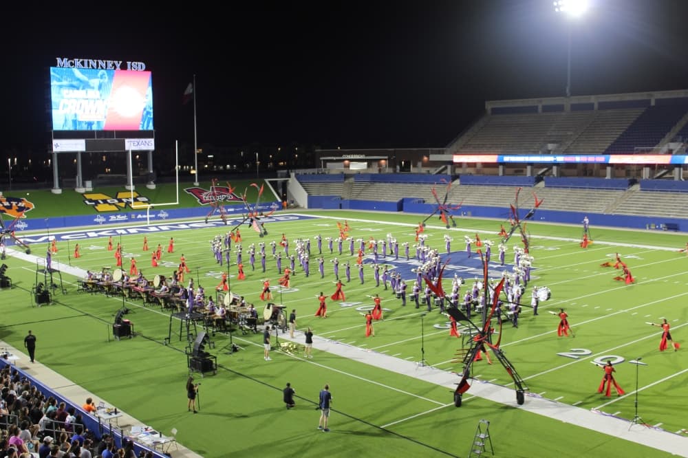The Carolina Crown Drum and Bugle Corps perform during the DCI McKinney event held July 21 at McKinney ISD Stadium.