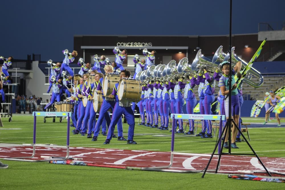 Members of the Blue Stars Drum and Bugle Corps perform during the DCI McKinney event held July 21 at McKinney ISD Stadium.