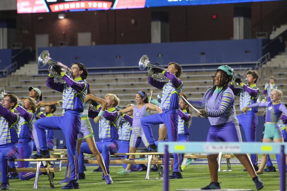 Members of the Blue Stars Drum and Bugle Corps perform during the DCI McKinney event held July 21 at McKinney ISD Stadium. 