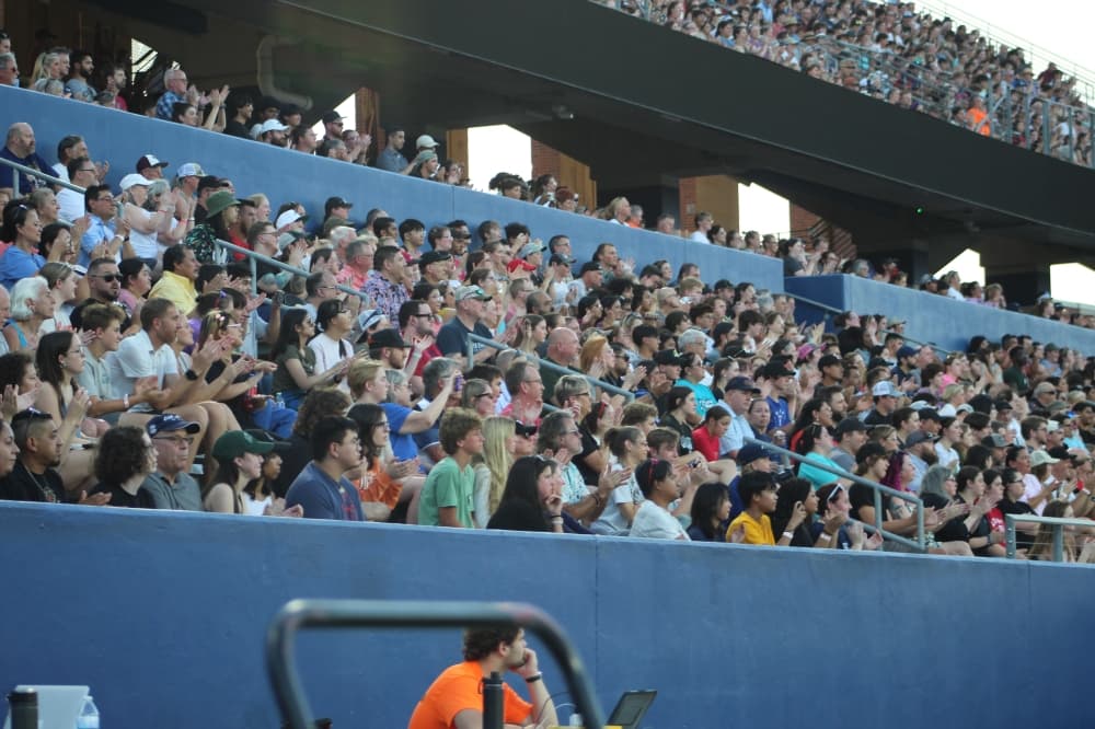 The crowd watches the Crossmen Drum and Bugle Corps perform during the DCI McKinney event held July 21 at McKinney ISD Stadium.