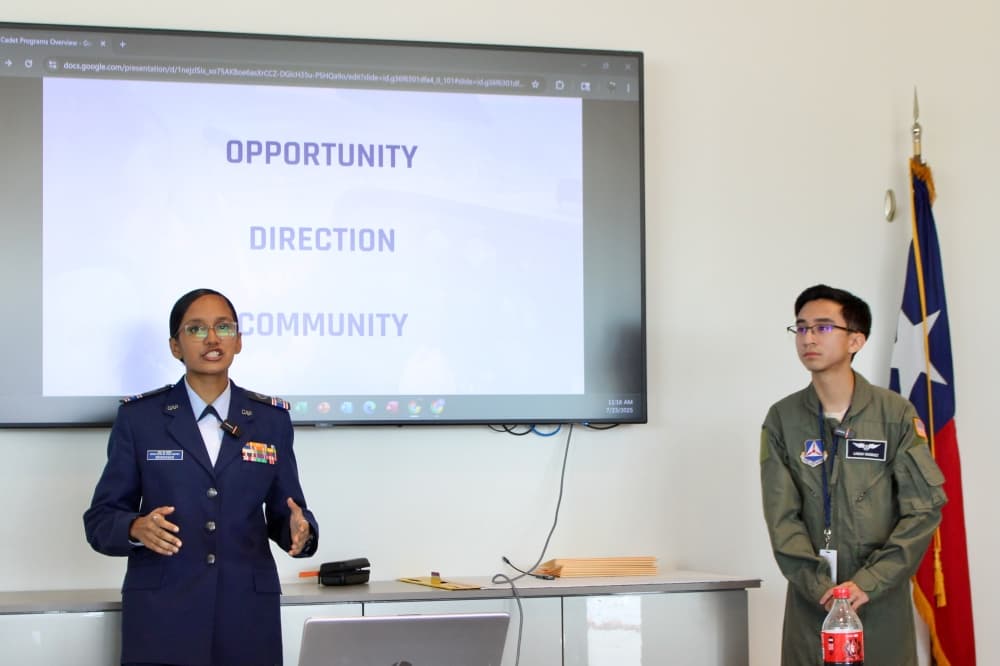 Cadet Daksha Srinivasan (left) speaks during a news conference held July 23 at McKinney National Airport. Flight Officer Logan Vasquez is pictured right.