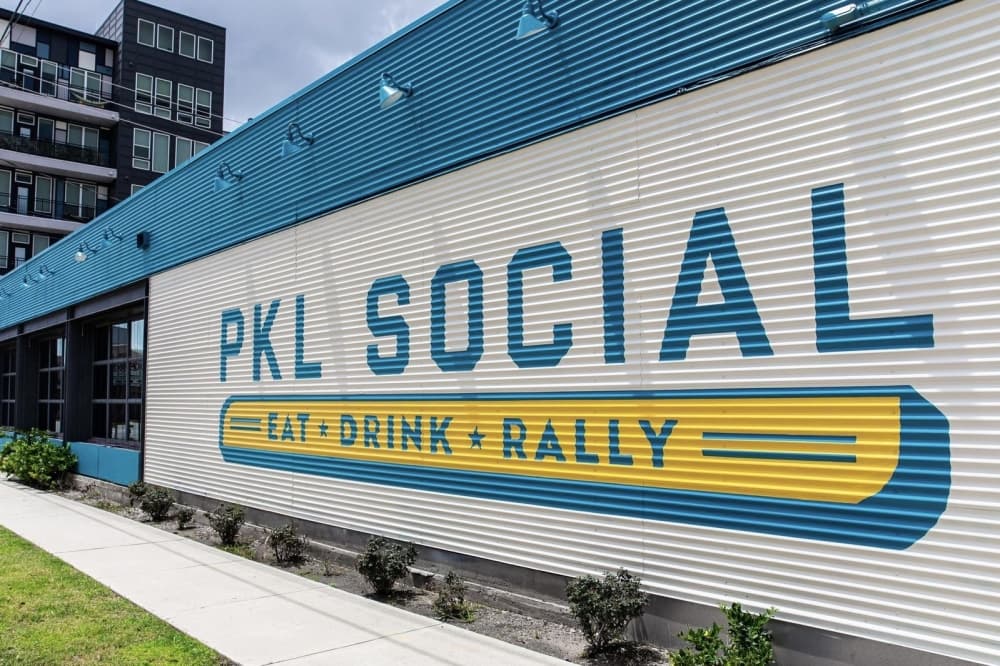 Popular Houston pickleball spot PKL Social expands to include golf simulators, updated menu