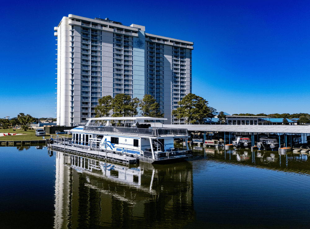 Luxury yacht charter from Little Palm Cruises docked at Margaritaville on Lake Conroe, ready for a private event.