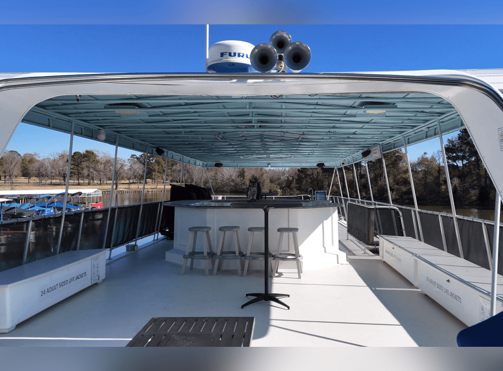 Little Palm Cruises private yacht departing Margaritaville dock on Lake Conroe for an unforgettable celebration on the water.