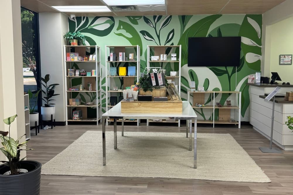 Interior of a business with stationery items on tables. 