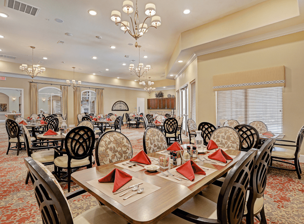 Beautiful dining room in Woodhaven Village offering restaurant-style meals for seniors in all levels of care.