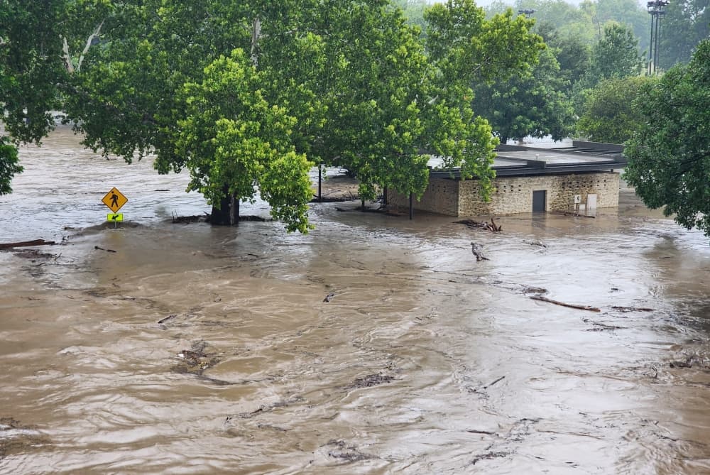 At 8:18 a.m. July 5, a building near San Gabriel Park was partially submerged in water from the overflowing San Gabriel River. 