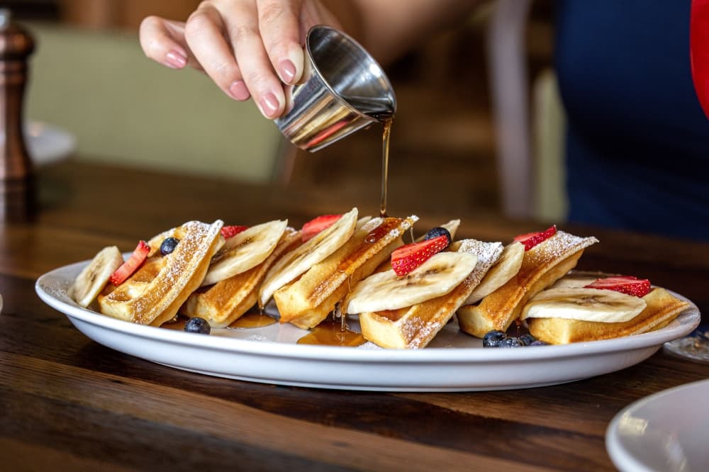 waffles with fruit and syrup
