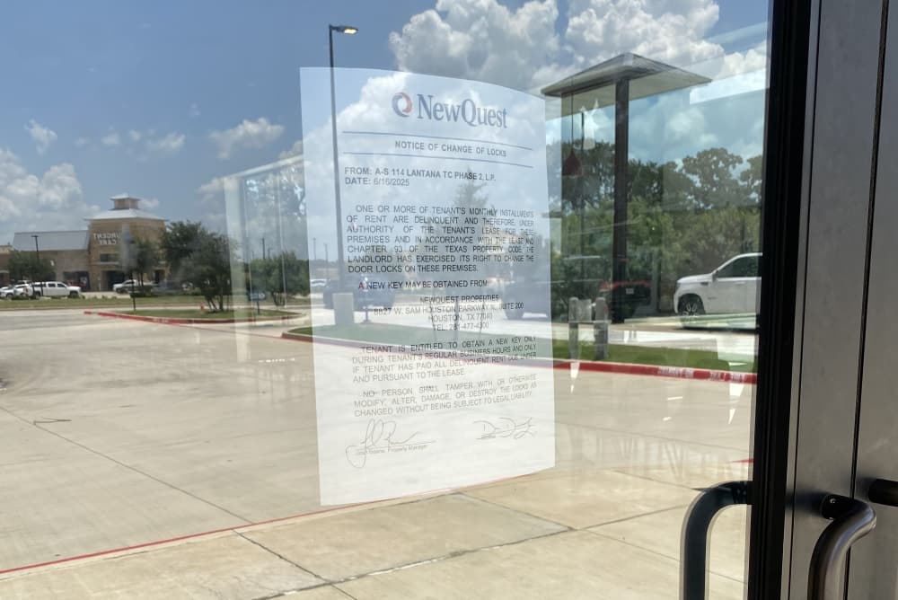 A lockout notice inside the front door of a restaurant.