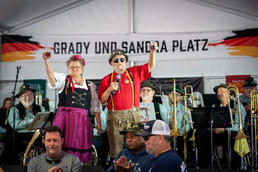 a man and woman dressed in German attire