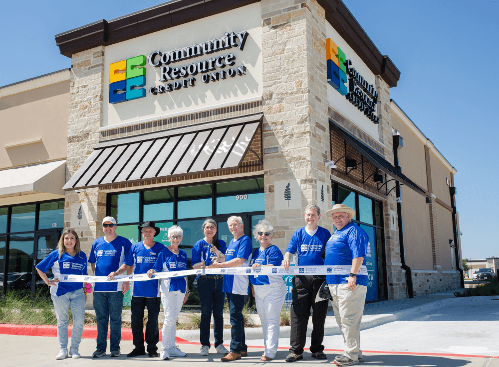 Community Resource Credit Union staff celebrates a grand opening event in Montgomery County with local members and community leaders.