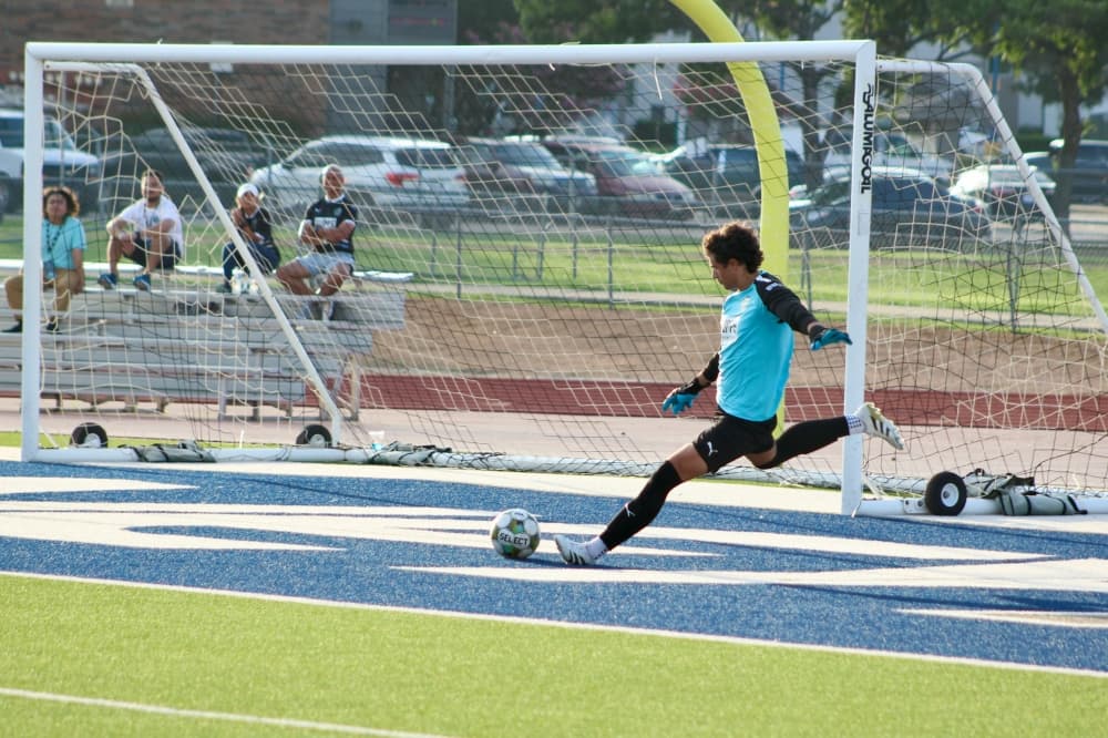 McKinney Chupacabras FC player kicking a ball