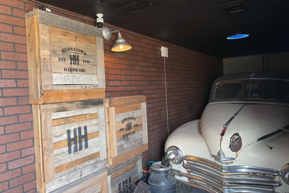 old car and wooden crates