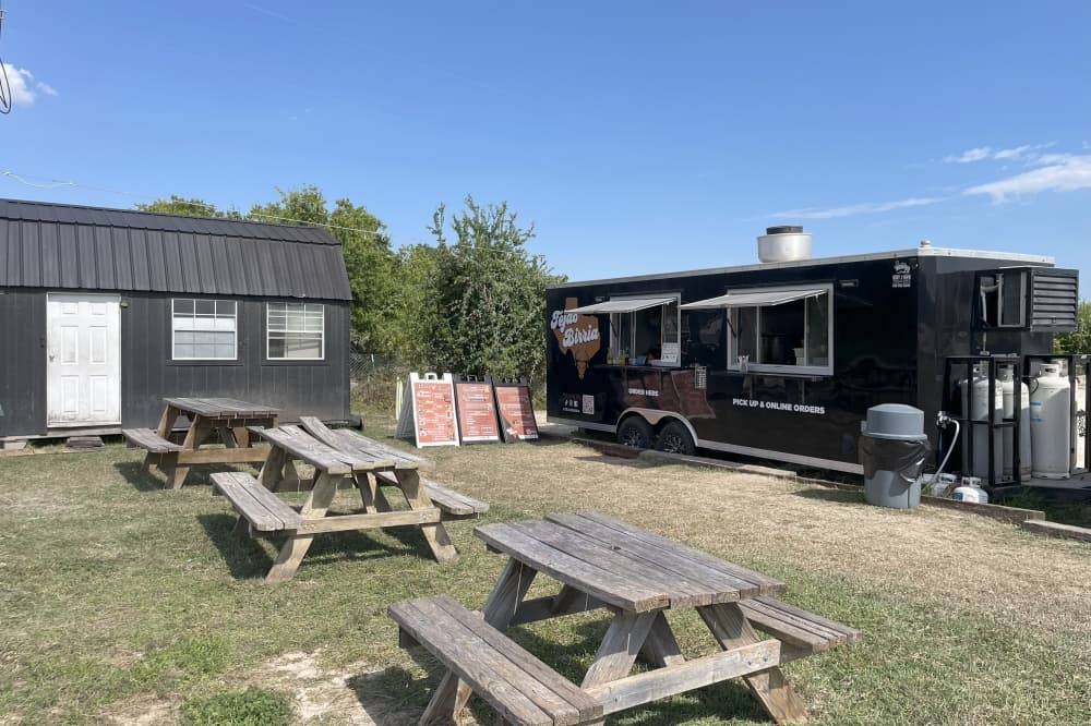 food truck and picnic tables