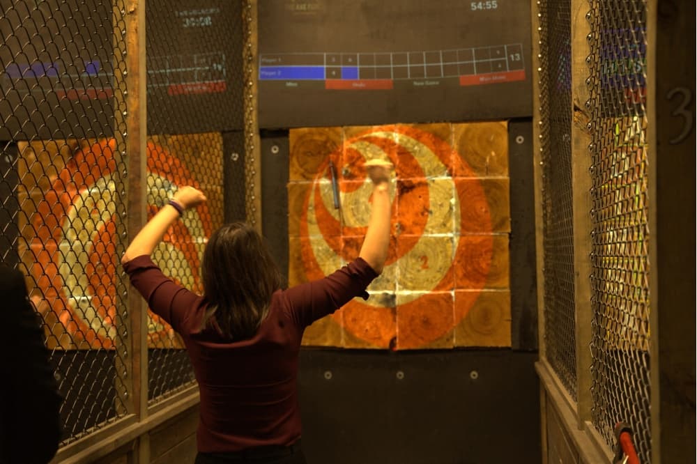 An image of someone axe throwing. 