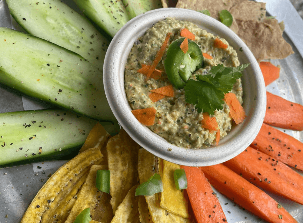 Fresh hummus and pita at a Tomball eatery known for global flavors and locally sourced ingredients.