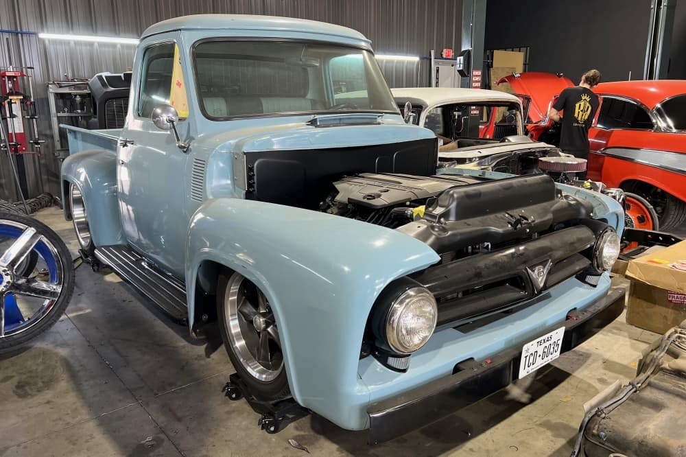 The image shows a lowered obs truck with its hood off. 