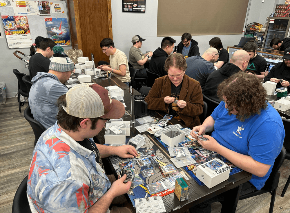 Kids and adults enjoying Pokémon trading card night at Conroe's top comic and game store.