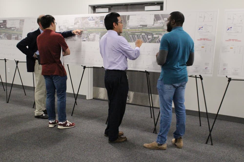 people look at poster boards