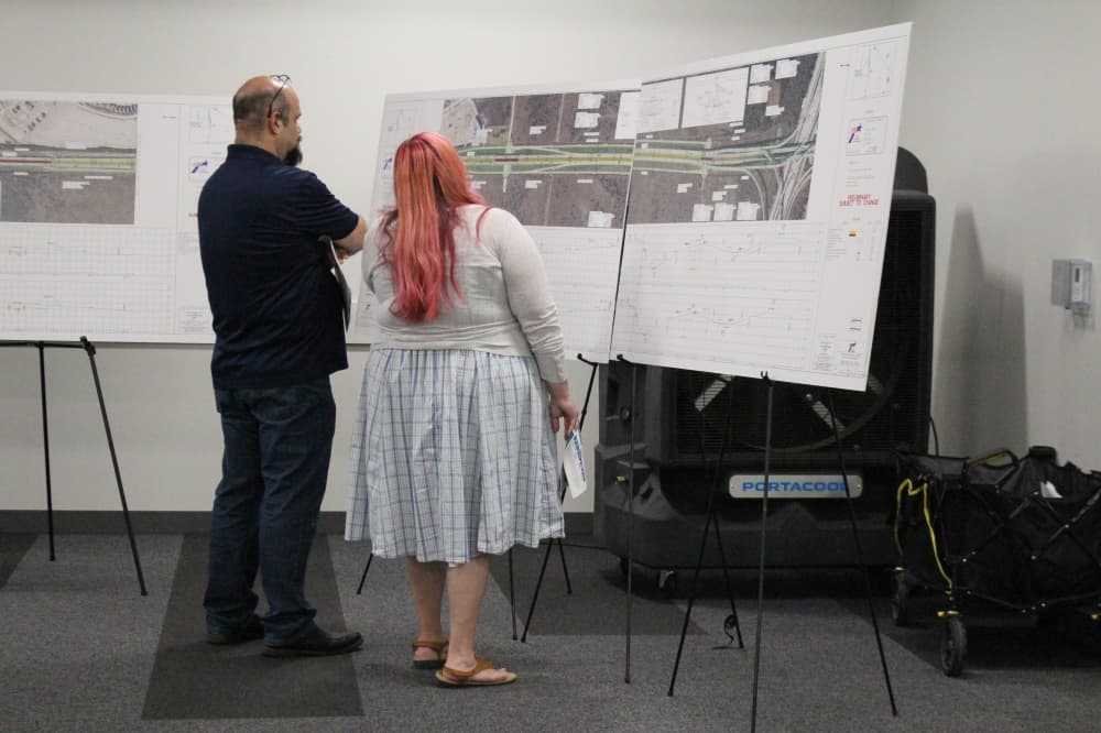 people look at poster boards
