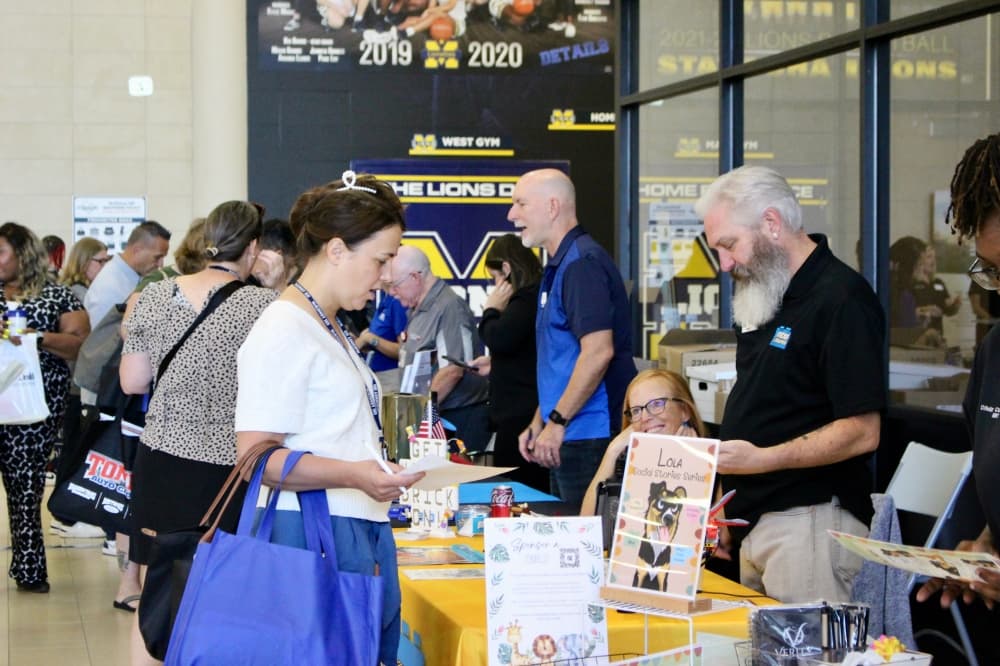 Teacher talking to vendor