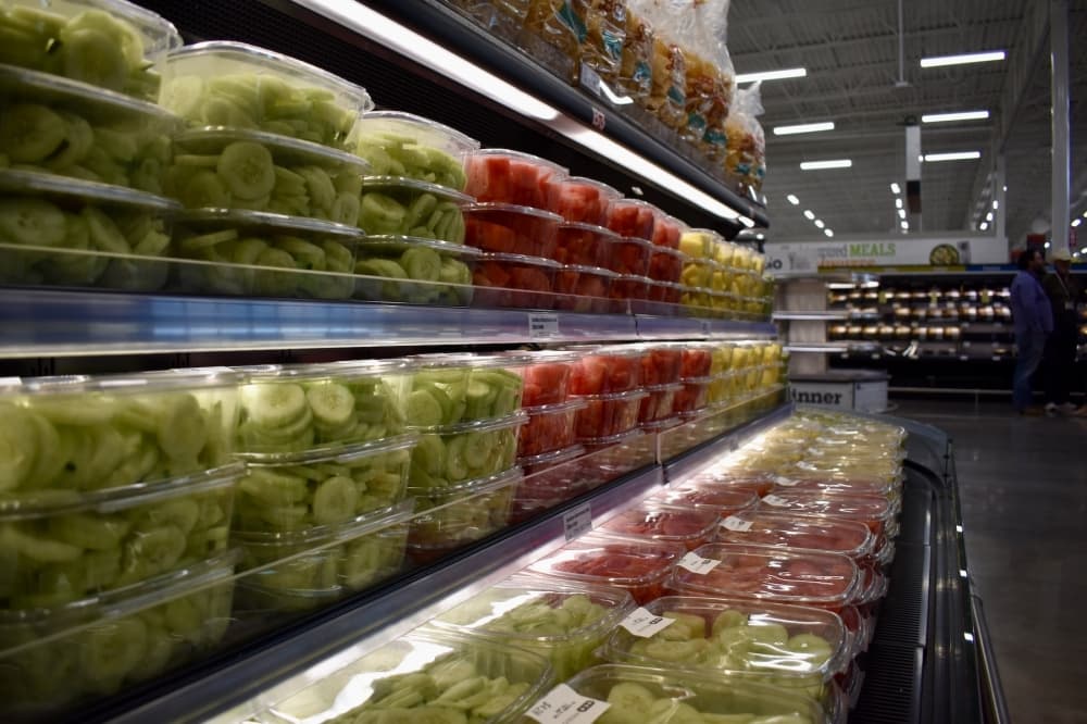 a grocery store fridge with fresh produce