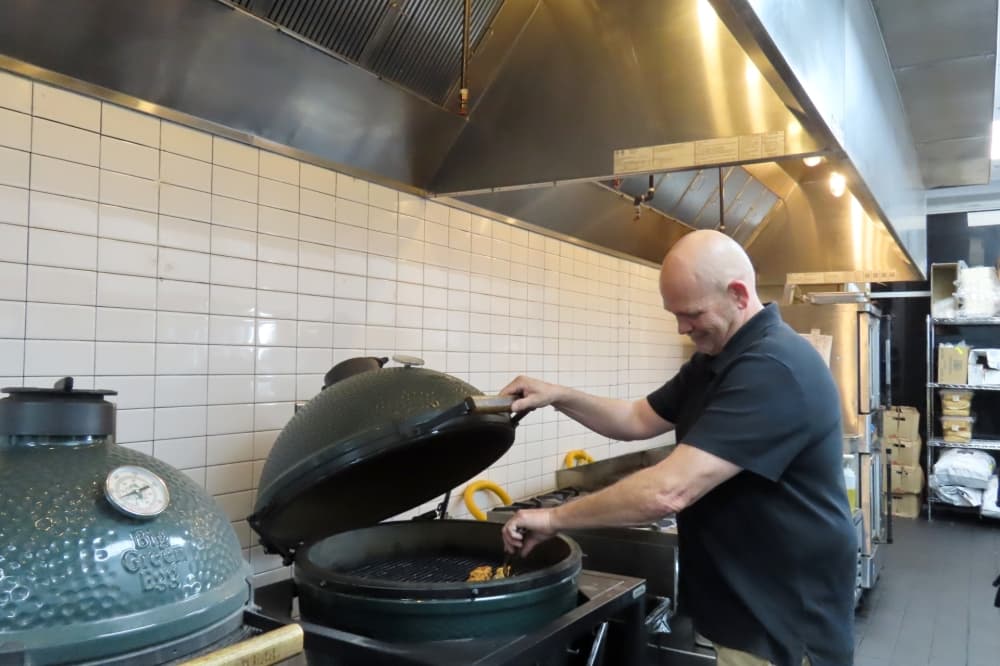 Owner James Zemlock said the restaurant cooks on a "Big Green Egg" grill, a kamado-style charcoal grill. (Jacquelyn Burrer/Community Impact)