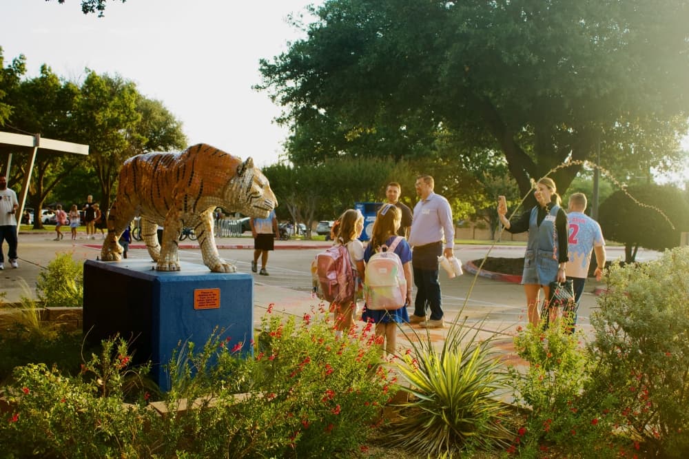 Parents take photos of their students on the first day of school. (Heather McCullough/Community Impact)