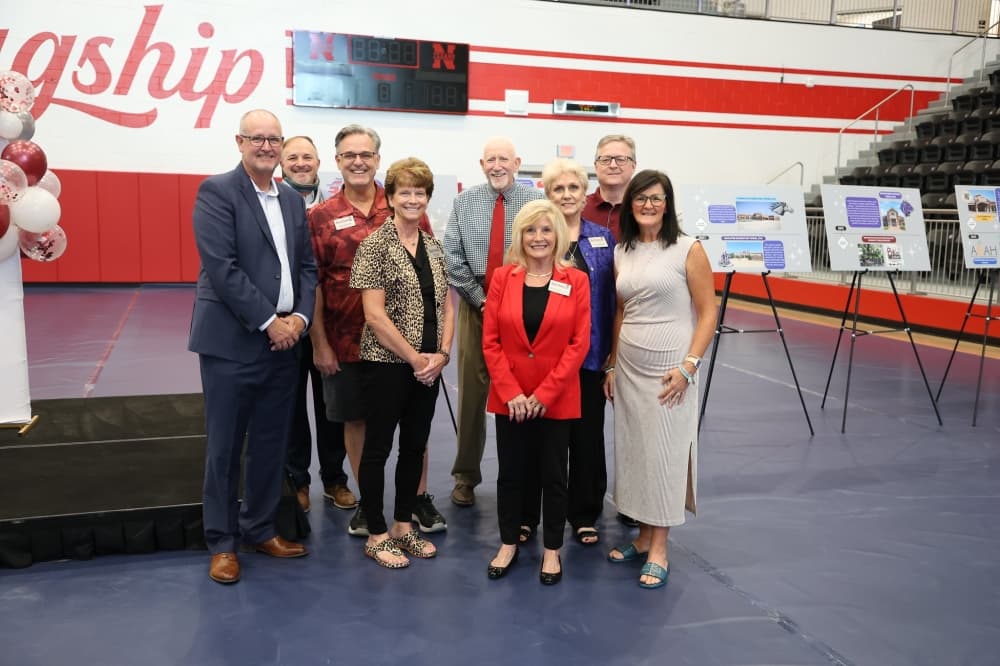 NISD Board of Trustees pose for a photo at the district's 75th anniversary event
