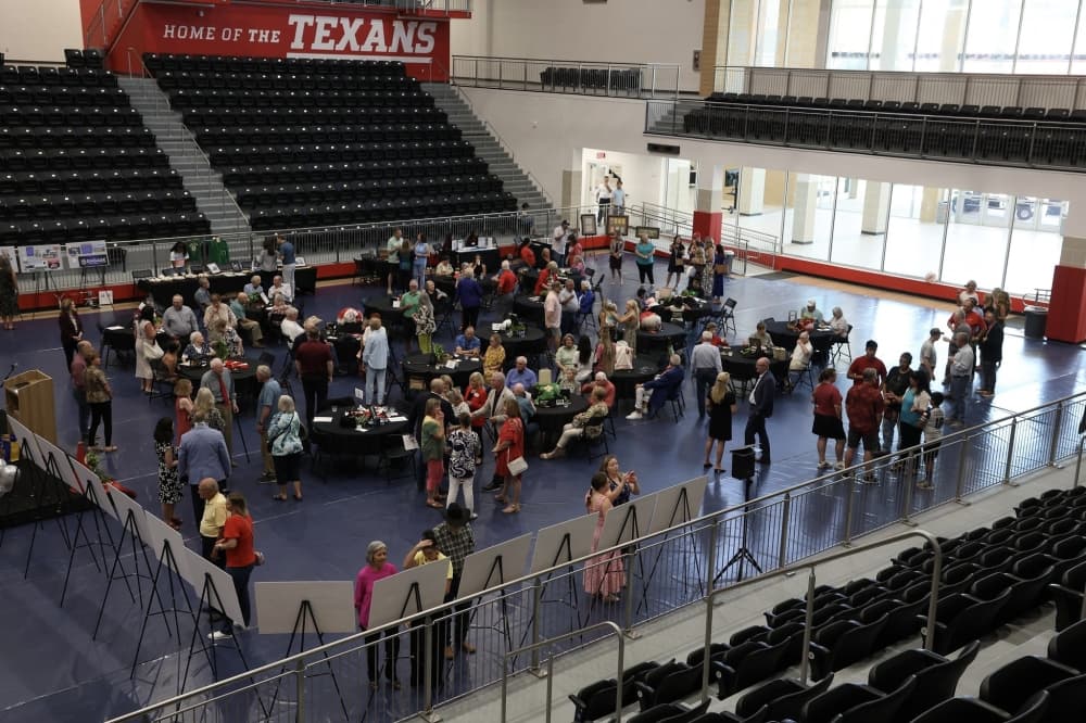 The crowd of administrators and former NISD graduates gathered at the district's 75th anniversary event