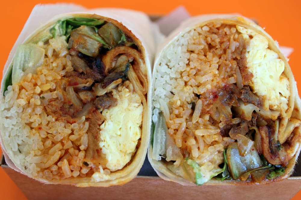 Meat, rice and vegetable burrito.