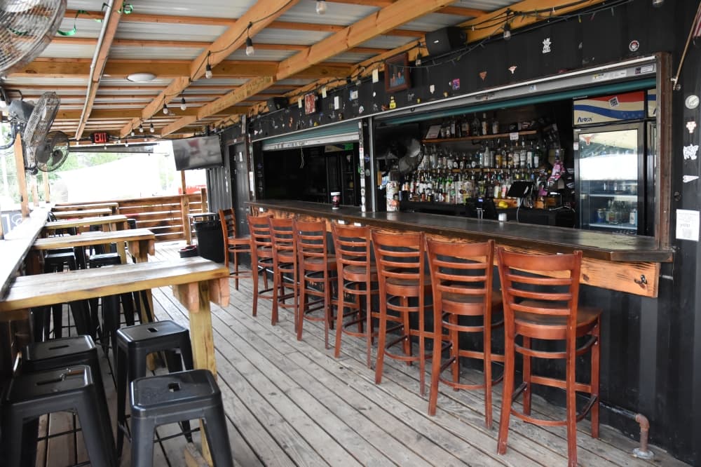 The image shows an outdoor bar. 