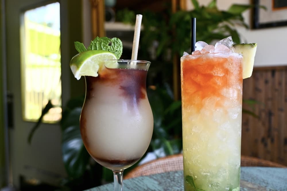 The La Bruha (left) is a tequila-based frozen cocktail made with spicy ginger beer, habanero tincture and elderberry liqueur. (Roo Moody/Community Impact)