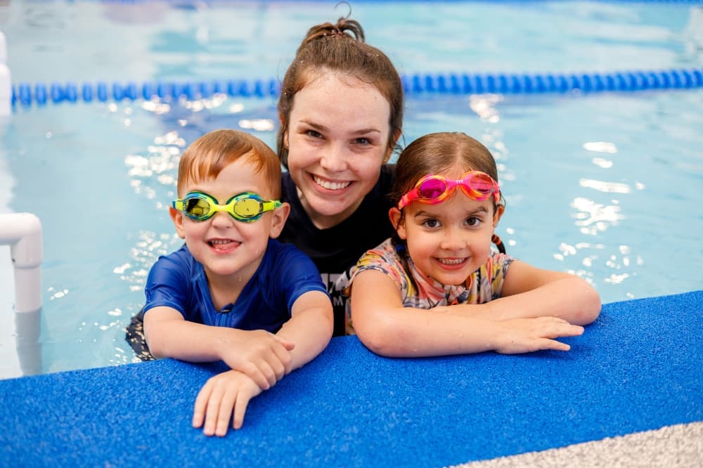 Two students and an instructor in a SafeSplash pool.