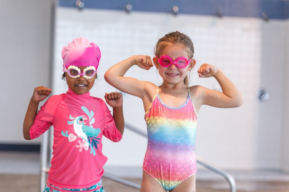 Two SafeSplash students in swimming gear.