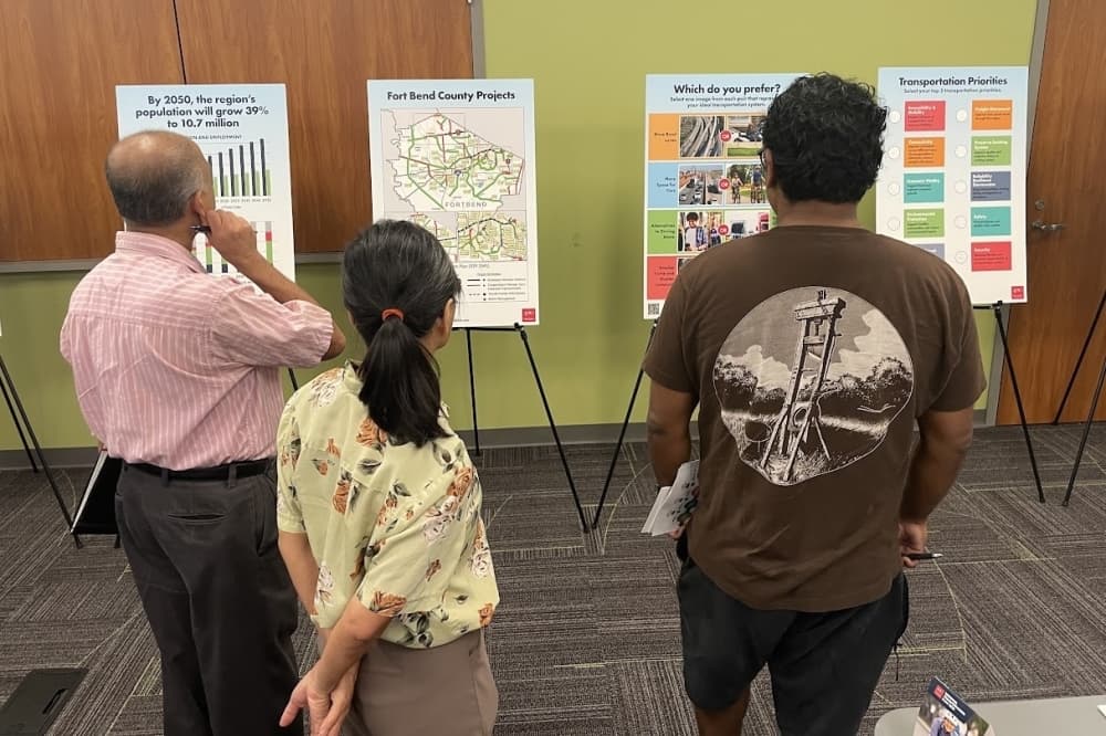 people look at poster boards