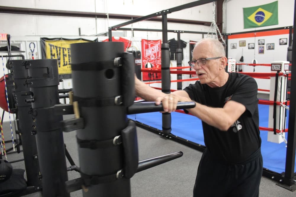 Grand Master Raymond Crow demonstrates a training drill at Crow’s Martial Arts Academy in McKinney.