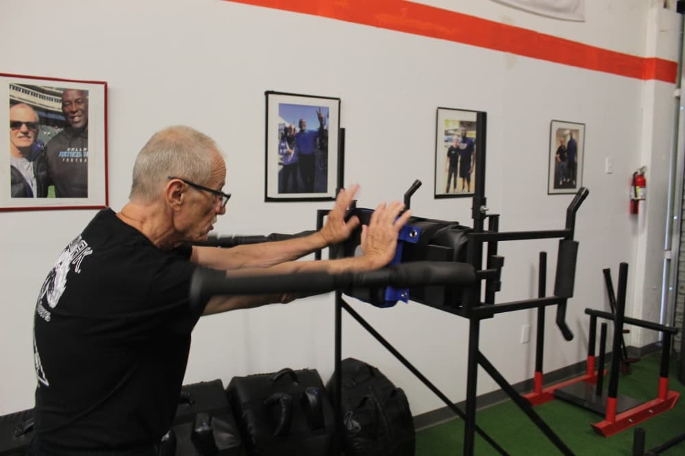 Grand Master Raymond Crow demonstrates a training drill at Crow’s Martial Arts Academy in McKinney.