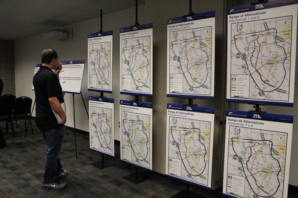 man looks at a map