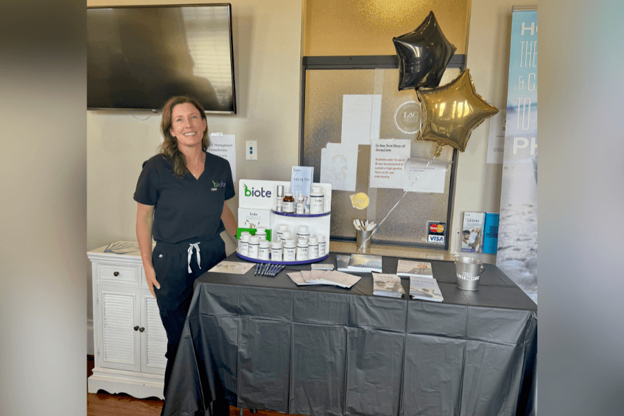 Medical providers and product representatives engaging with community members at the Spring-Klein open house highlighting skin rejuvenation and hormone therapy options.