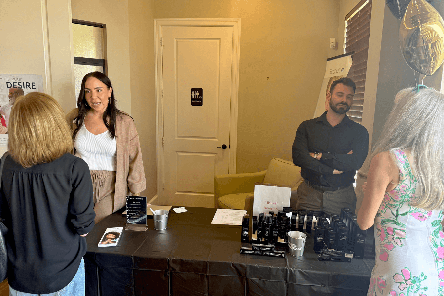 Demonstration of microneedling with SkinPen and Secret RF, educating guests on collagen production and skin smoothing benefits in Spring-Klein.