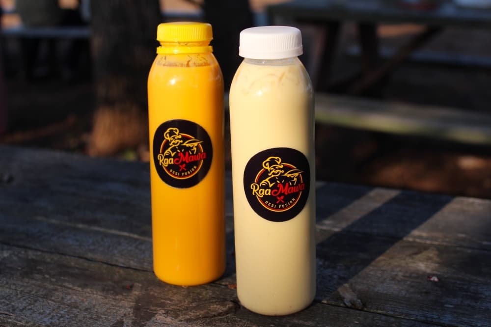 Two traditional Indian refreshments that Raa Mawa serves are mango lassi, a sweet yogurt drink, and badam doodh, a milk-based drink with almonds and cardamom. (Sienna Wight/Community Impact)