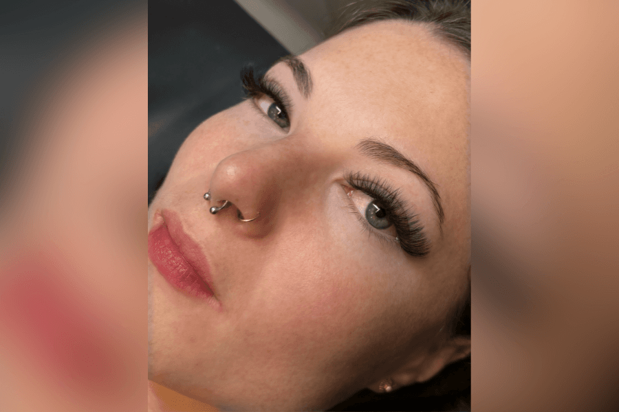 Client enjoying her lash extensions after her appointment at The Lash Lounge in Westlake, combining beauty services with restorative self-care.