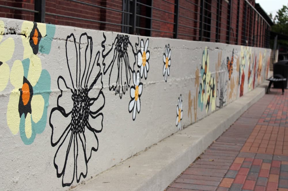 Flowers painted on a foundation wall. 