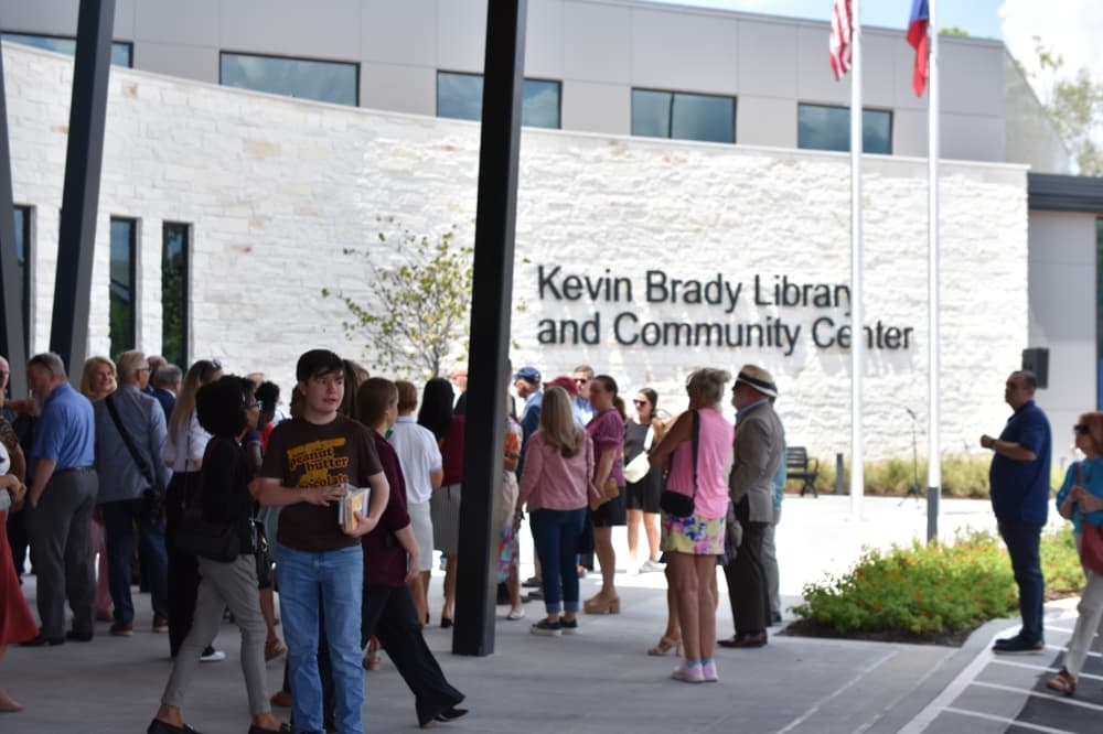 people gathered outside a library