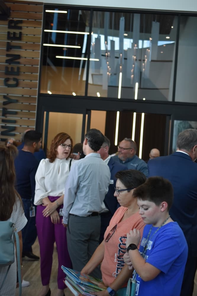 people gathered at a library opening