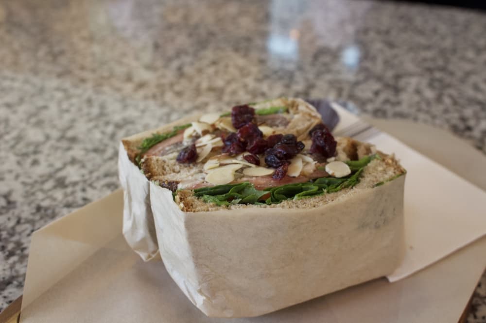 The spring angel chicken salad sandwich ($14) includes chicken salad, spring mix, tomato, dried cranberries and sliced almonds on toasted multi-grain bread.