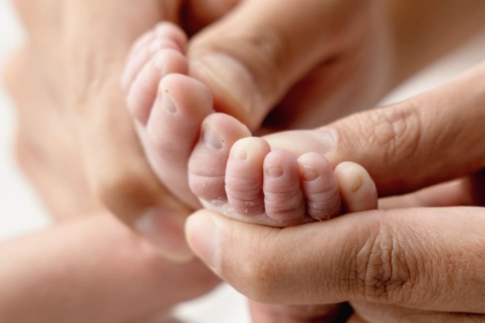 hands and baby feet